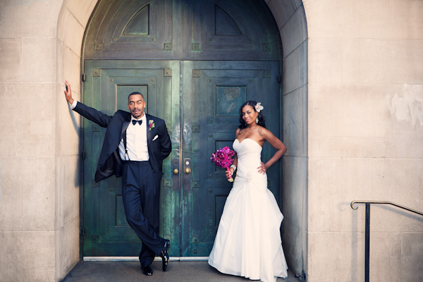 happy couple posing in doorway - photo by Southern California wedding photographers Callaway Gable